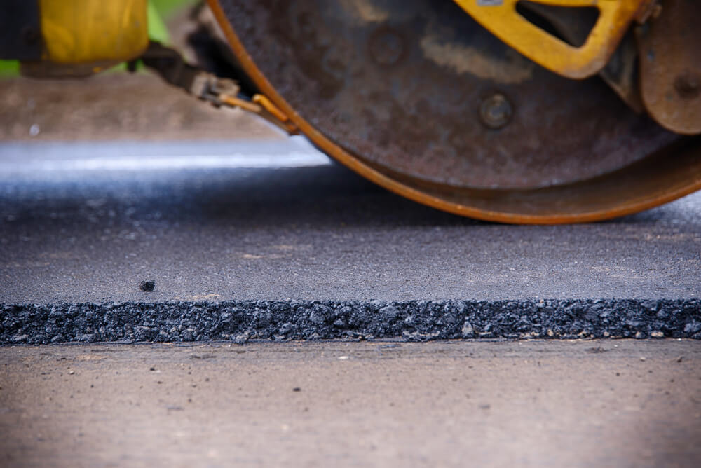 Compactor or roller paving asphalt.